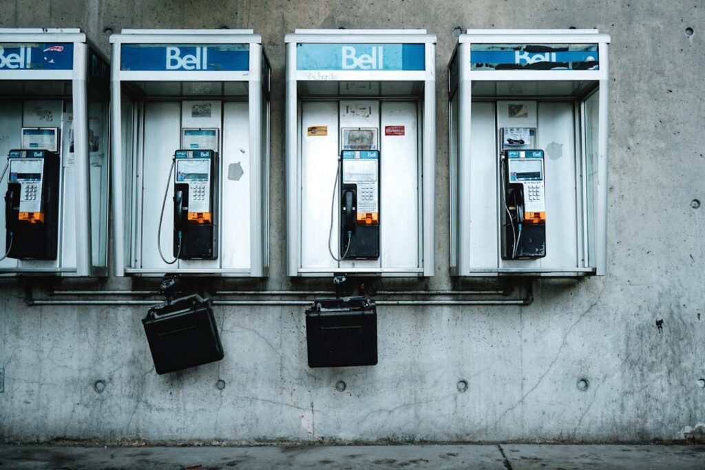 Vintage Bell telephone booths on a Toronto street representing urban nostalgia.