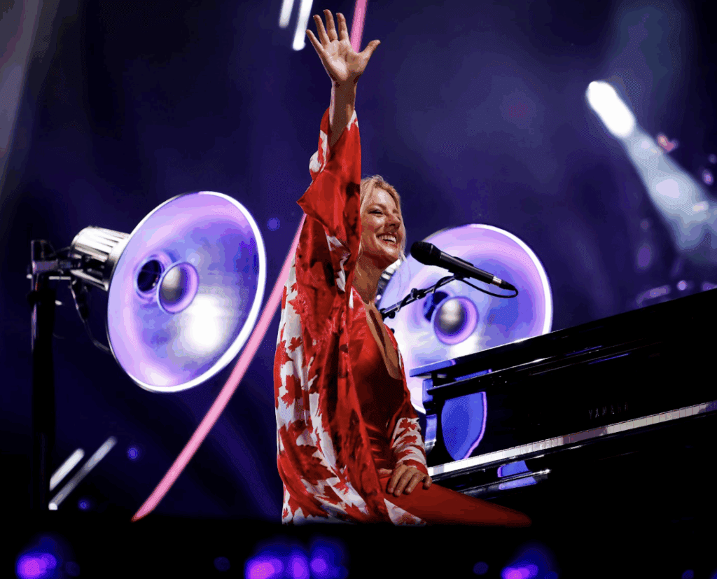Sarah McLachlan waving to the crowd. Photo Credit: Eric Myre