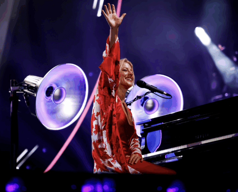 Sarah McLachlan waving to the crowd. Photo Credit: Eric Myre