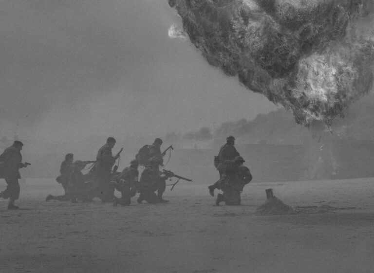 Silhouetted soldiers running through a battlefield under heavy smoke and explosions, illustrating the consequences behind casual war talk.