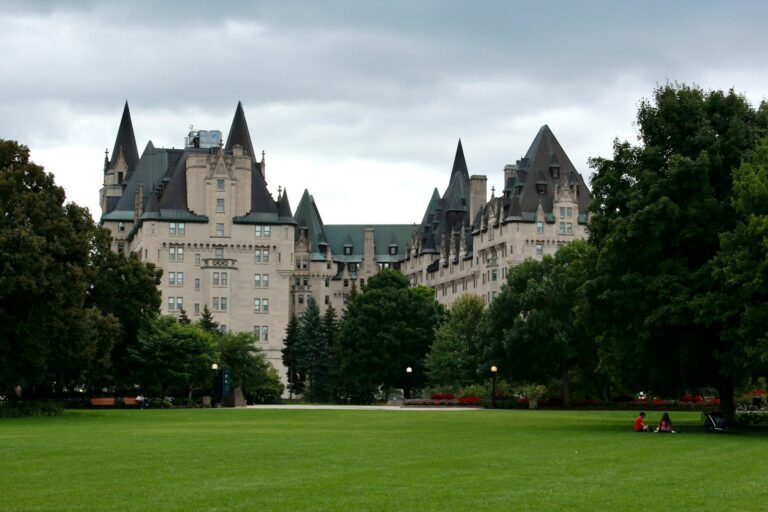 A large building with a large lawn in front of it
