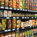 Grocery store aisle in Canada showing shelf prices and packaged foods, illustrating ongoing grocery costs and the debate over the gst rebate
