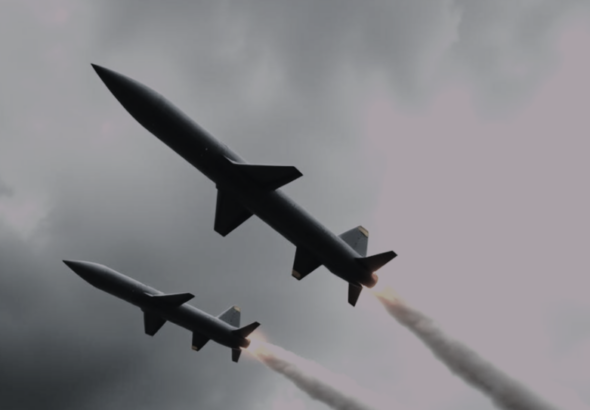 Modern ballistic missiles flying through a grey sky, illustrating the impact of Canada’s new Defence Industrial Strategy.