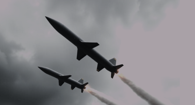 Modern ballistic missiles flying through a grey sky, illustrating the impact of Canada’s new Defence Industrial Strategy.