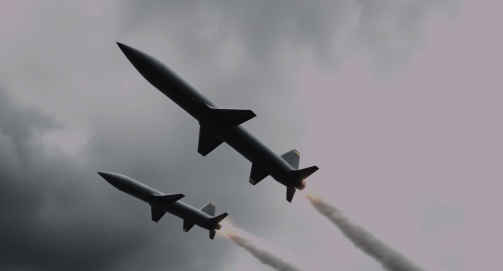 Modern ballistic missiles flying through a grey sky, illustrating the impact of Canada’s new Defence Industrial Strategy.